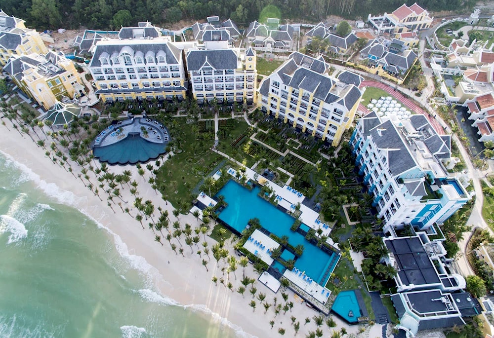 JW Marriott Phu Quoc Emerald Bay showcases stunning French colonial architecture along Khem Beach, featuring overwater villas and world-class amenities